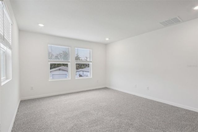 empty room with carpet flooring