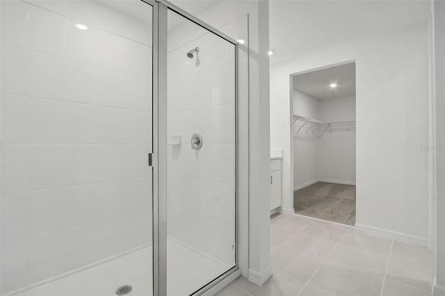 bathroom with tile patterned floors and a shower with shower door