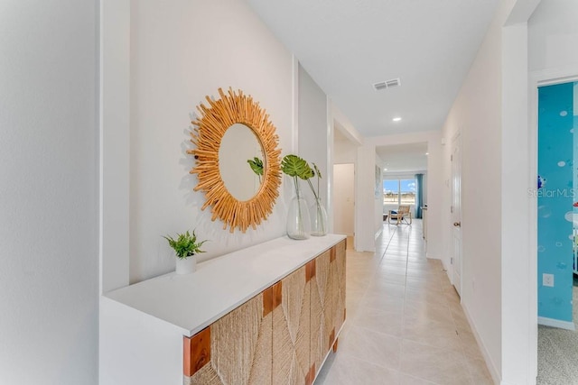 hall featuring light tile patterned flooring