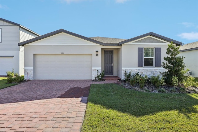 ranch-style house with a front lawn and a garage