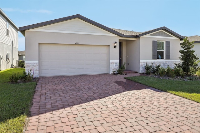 ranch-style house featuring central AC unit, a front yard, and a garage