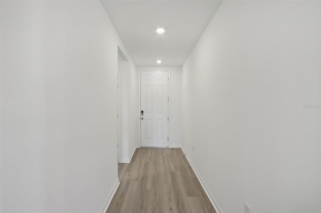 corridor featuring light hardwood / wood-style flooring