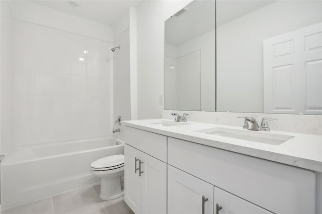 full bathroom with toilet, vanity, tiled shower / bath combo, and tile patterned floors