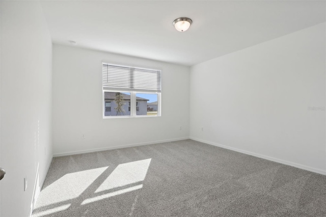 empty room featuring carpet flooring