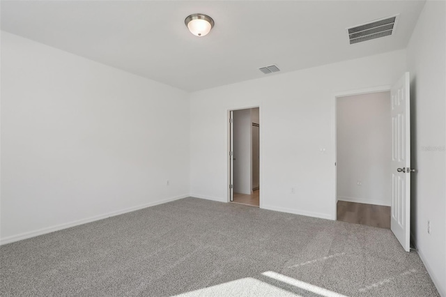 unfurnished room with light carpet