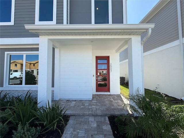 entrance to property featuring central air condition unit