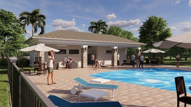 view of pool with a patio, fence, and an outdoor structure