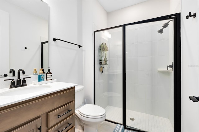 bathroom featuring walk in shower, vanity, and toilet