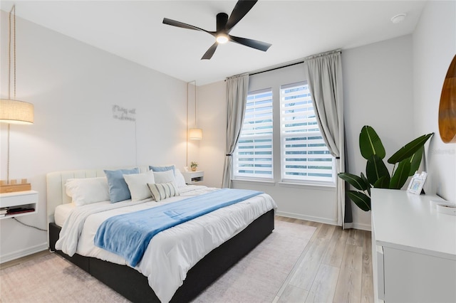 bedroom featuring ceiling fan and light hardwood / wood-style floors