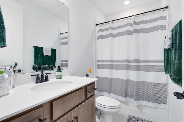 full bathroom featuring shower / tub combo, vanity, and toilet