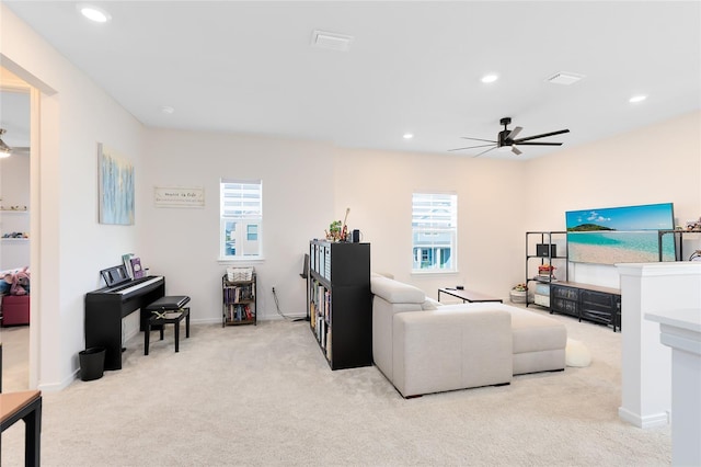 living room featuring ceiling fan and light carpet