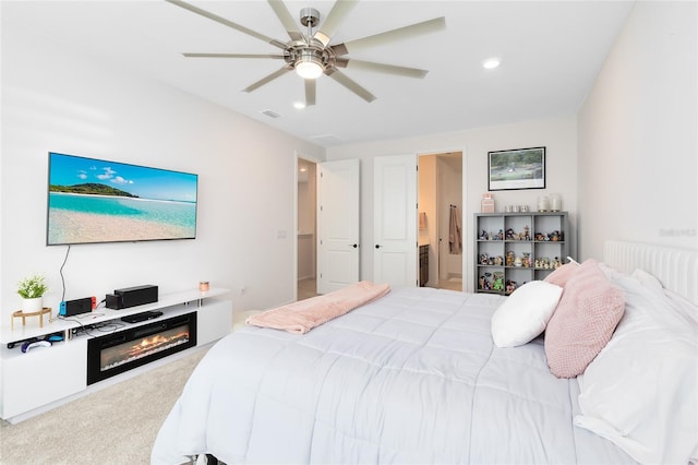 bedroom with ceiling fan and carpet floors