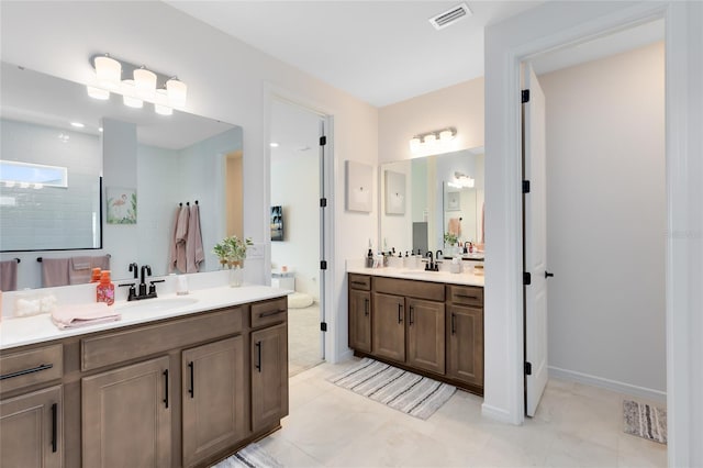 bathroom featuring tile patterned floors and vanity