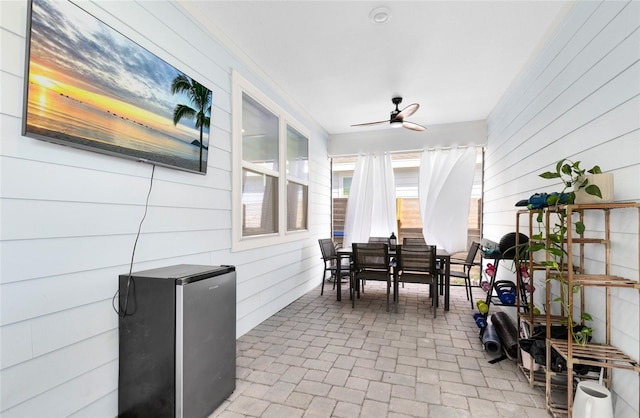 sunroom / solarium with ceiling fan