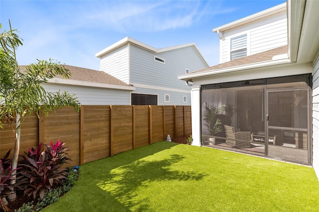 view of yard featuring a sunroom