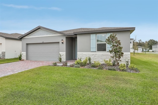 view of front facade with a front yard and a garage