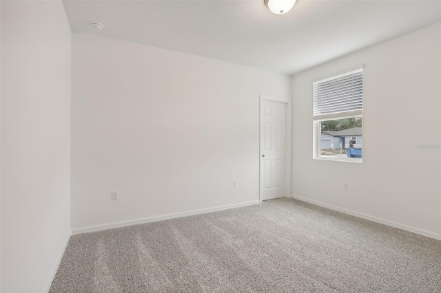 spare room featuring carpet floors