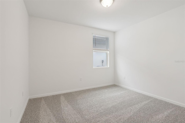 spare room featuring carpet floors