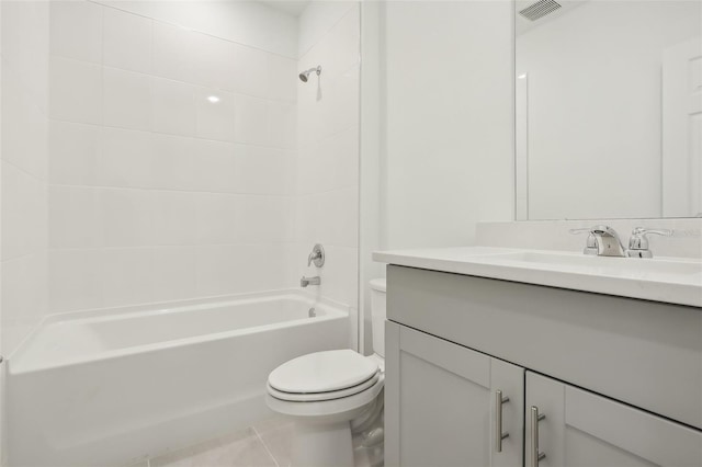 full bathroom with tile patterned floors, vanity, toilet, and tiled shower / bath