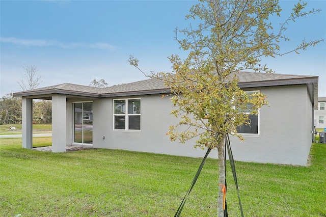 back of house with a yard