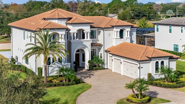 mediterranean / spanish house featuring a garage