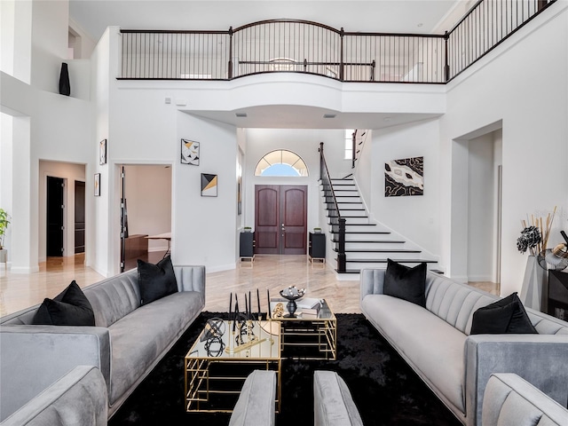 living room with a high ceiling