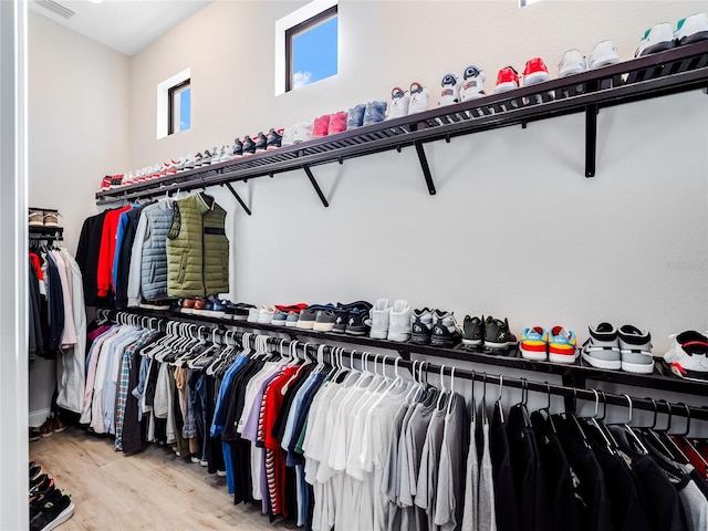 spacious closet featuring light hardwood / wood-style flooring