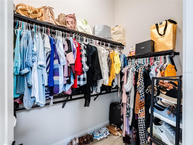 walk in closet featuring hardwood / wood-style flooring