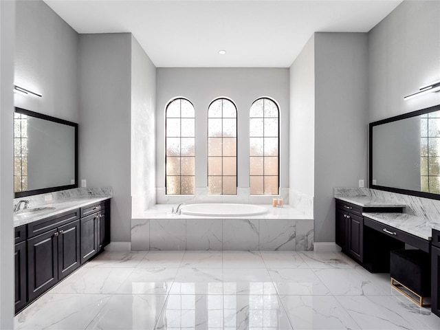 bathroom featuring vanity, tiled bath, and plenty of natural light