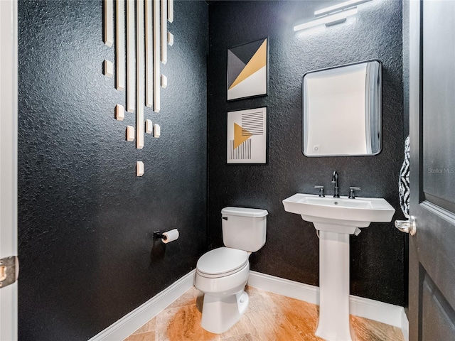 bathroom featuring toilet