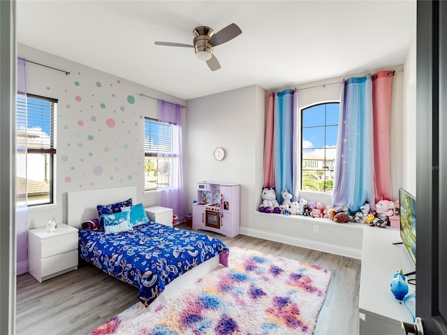 bedroom featuring ceiling fan and light wood-type flooring