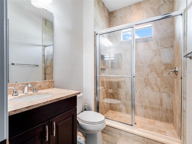 bathroom with vanity, toilet, and walk in shower