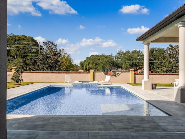 view of pool featuring an in ground hot tub and a patio area