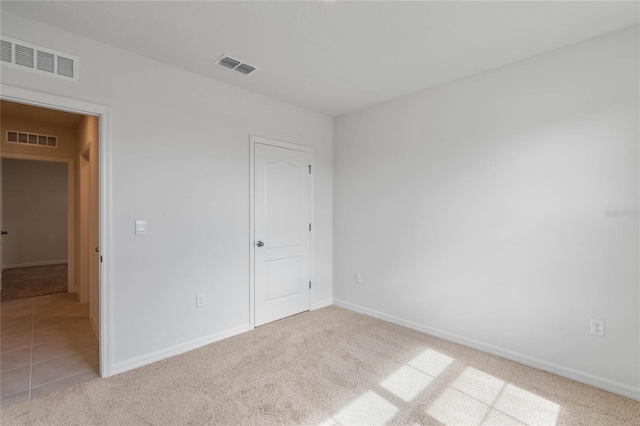 unfurnished bedroom with light carpet