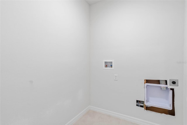 washroom with washer hookup, light tile patterned floors, and electric dryer hookup