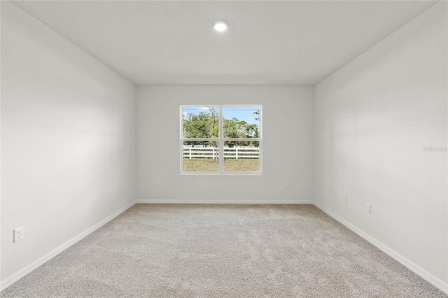 unfurnished room with carpet