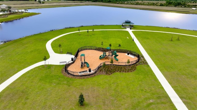 birds eye view of property with a water view