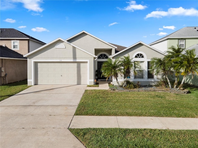 view of front of house featuring a front lawn and a garage