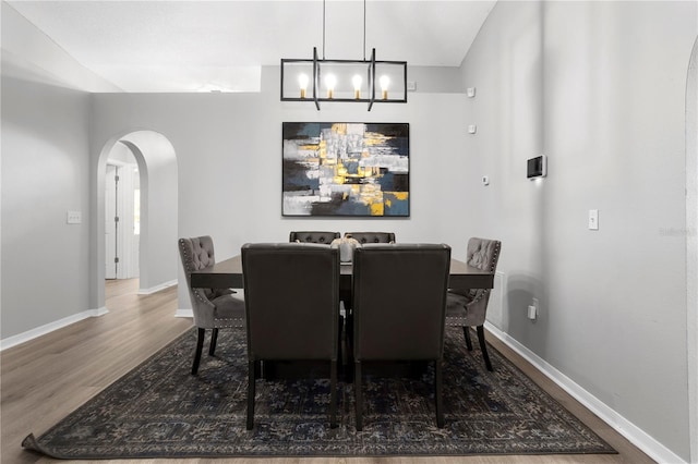 dining room featuring a chandelier and hardwood / wood-style flooring