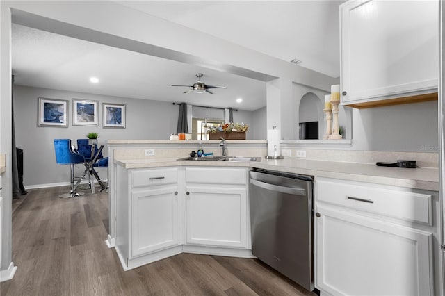 kitchen featuring white cabinets, stainless steel dishwasher, and sink