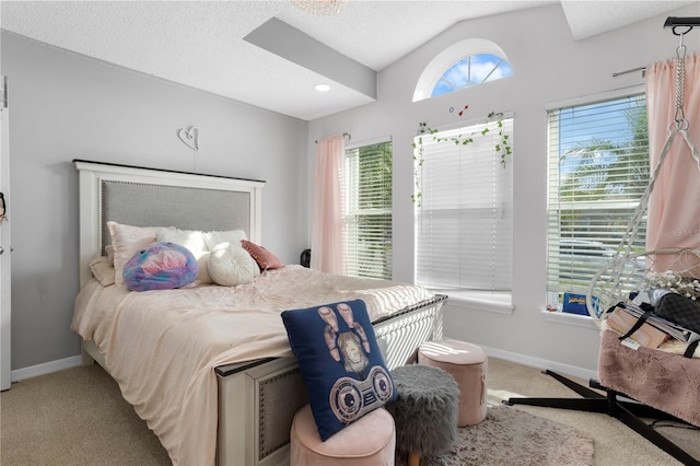 bedroom featuring a textured ceiling, lofted ceiling, and carpet floors