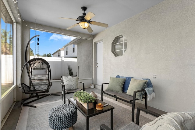 sunroom / solarium with ceiling fan