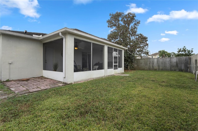 view of yard featuring a sunroom