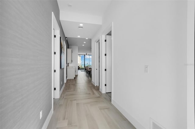 corridor featuring light parquet floors