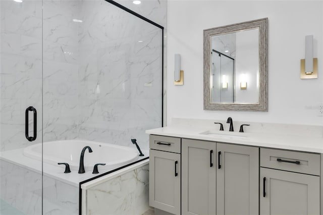 bathroom featuring vanity and separate shower and tub