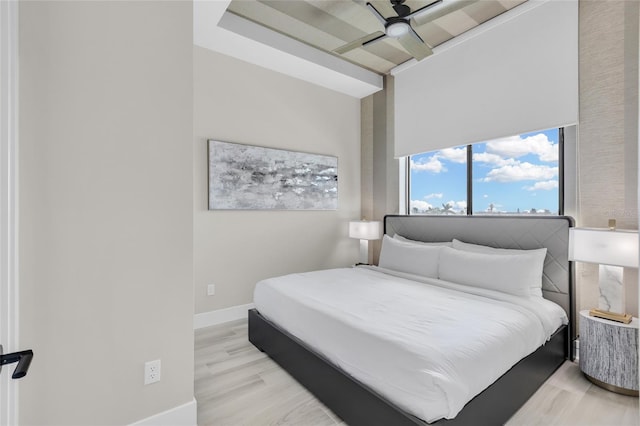 bedroom featuring light hardwood / wood-style floors and ceiling fan