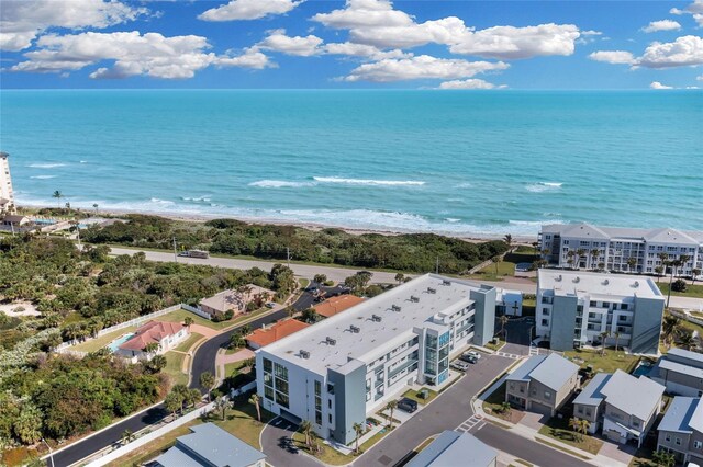 bird's eye view featuring a water view and a view of the beach