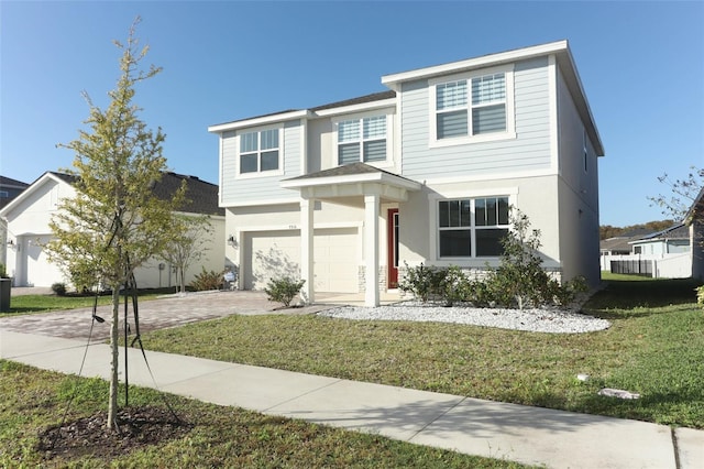 view of front property with a front yard and a garage