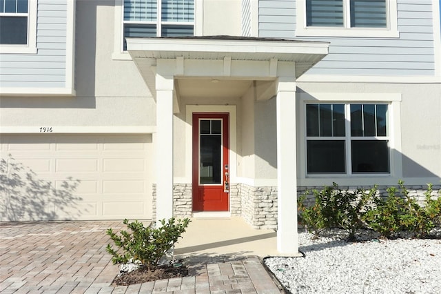 property entrance with a garage