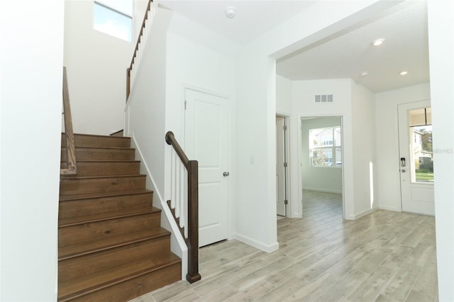 stairway featuring hardwood / wood-style flooring